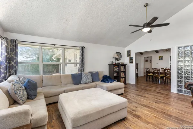 a living room with furniture and a large window