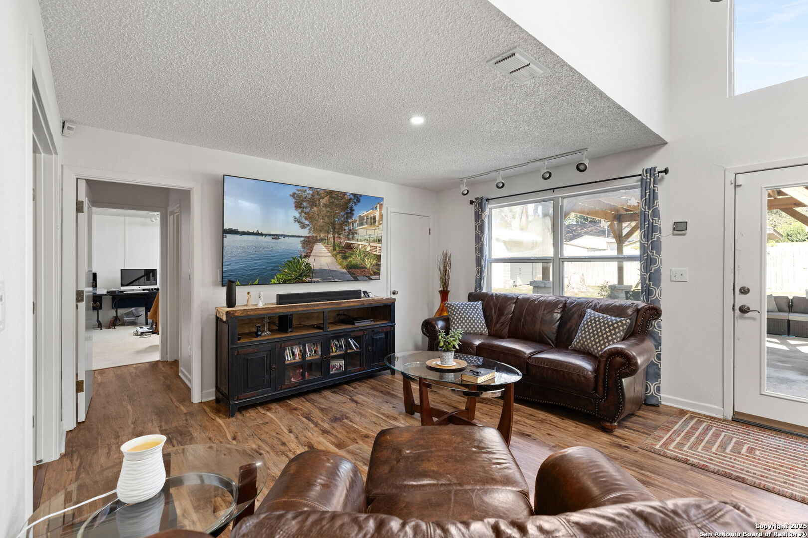 713 Fawndale Lane Windcrest, TX 78239 - Photo 18 of 31 a living room with furniture and a flat screen tv