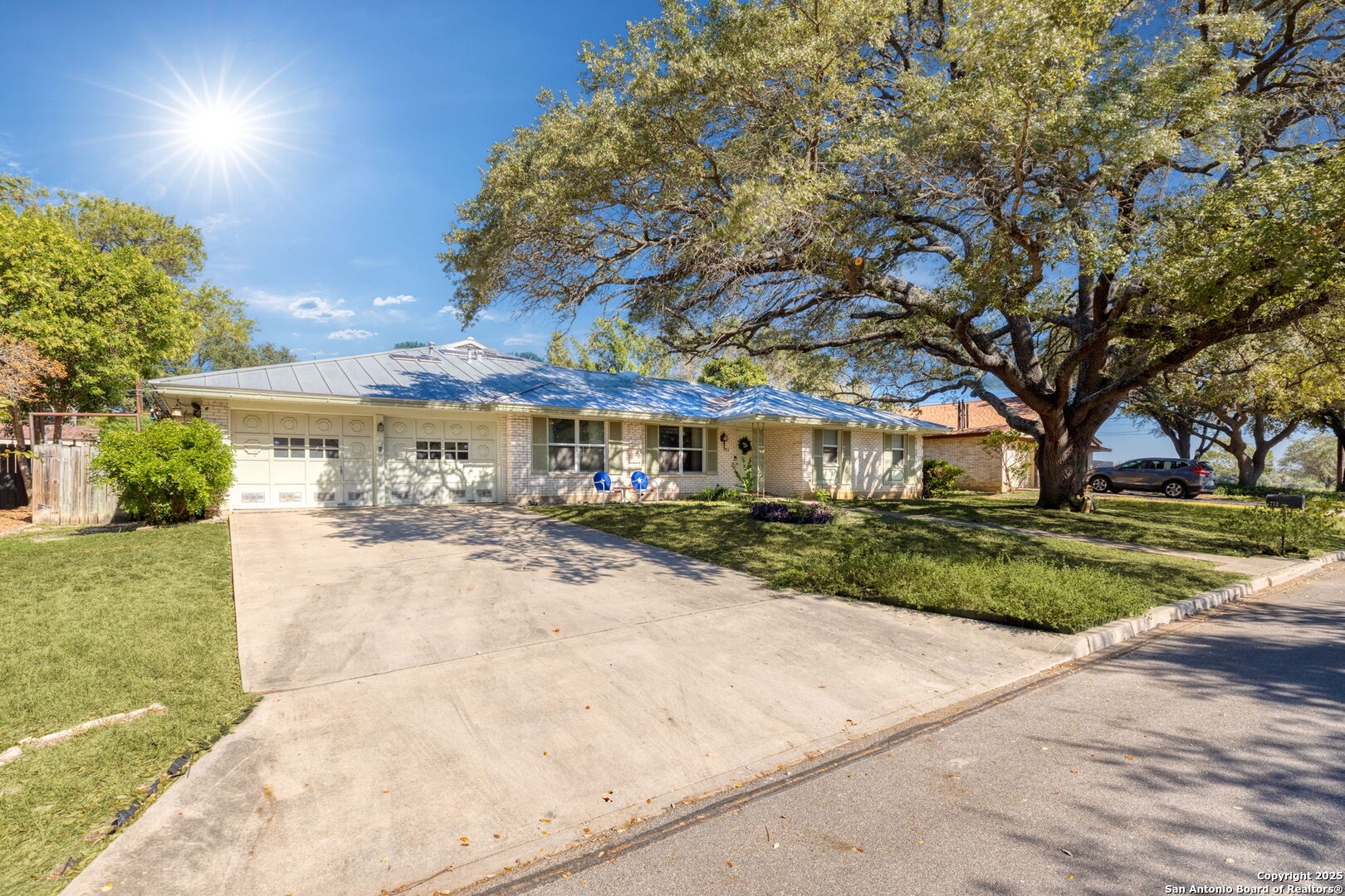 713 Fawndale Lane Windcrest, TX 78239 - Photo 2 of 31 a front view of a house with a yard and potted plants