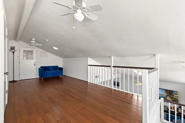 a view of livingroom with hardwood floor and a ceiling fan