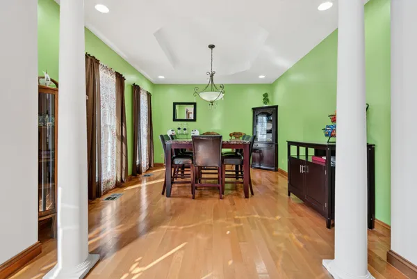 a view of a dining room with furniture window and wooden floor