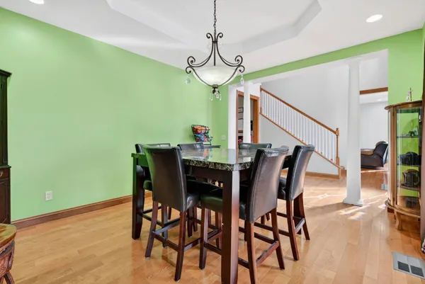 a kitchen with stainless steel appliances granite countertop a stove and a refrigerator