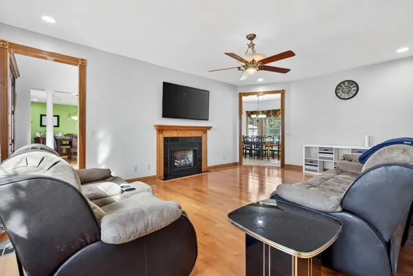 a kitchen with stainless steel appliances granite countertop a sink a counter space and a window