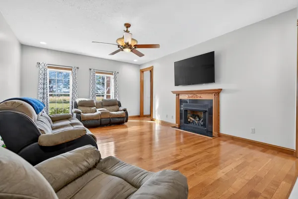 a kitchen with stainless steel appliances granite countertop a refrigerator a stove and a sink