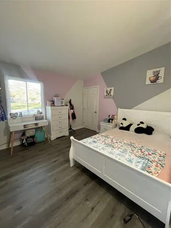 a bed room with a bed and a window