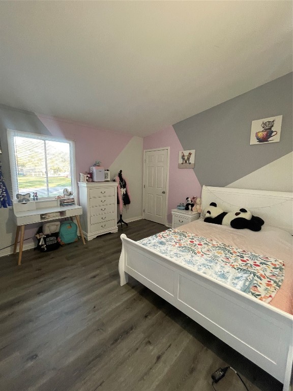 611 Sarah Street Edna, TX 77957 - Photo 21 of 31 a bed room with a bed and a window