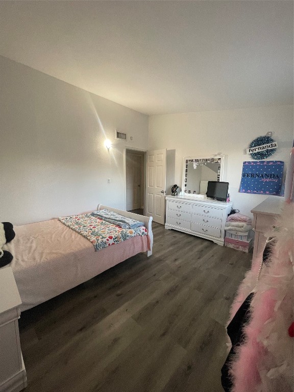 611 Sarah Street Edna, TX 77957 - Photo 22 of 31 a bedroom with a bed and a night stand