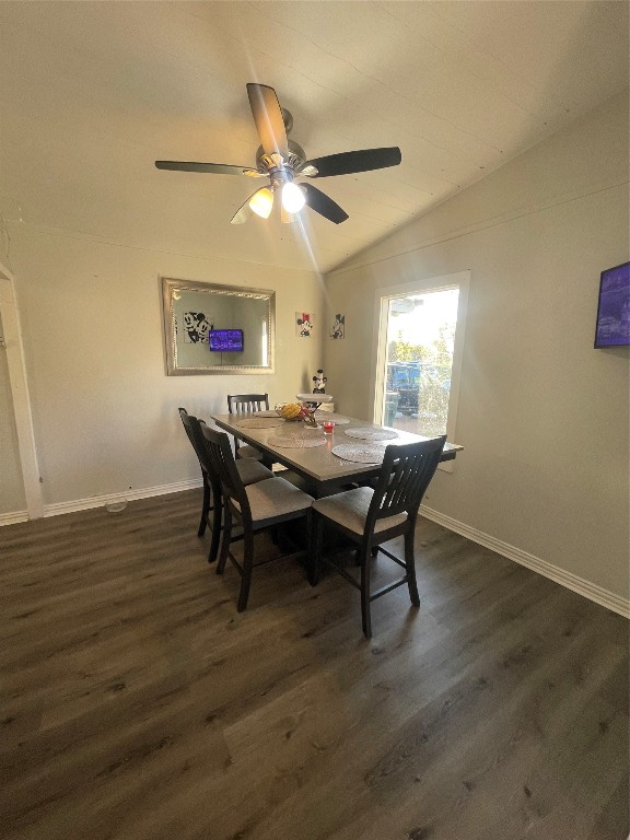 611 Sarah Street Edna, TX 77957 - Photo 9 of 31 a dining room with wooden floor a chandelier a wooden table and chairs