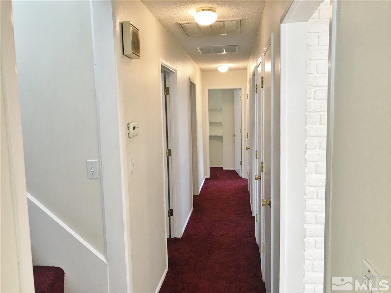 2130 Prince Way Reno, NV 89503 - Photo 12 of 25 a view of a hallway with a door and furniture