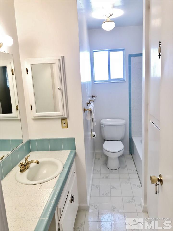 2130 Prince Way Reno, NV 89503 - Photo 13 of 25 a bathroom with a sink a toilet and a mirror