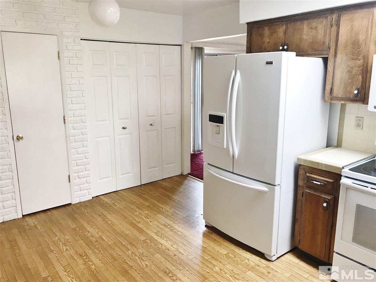 2130 Prince Way Reno, NV 89503 - Photo 7 of 25 a white refrigerator freezer sitting in a kitchen