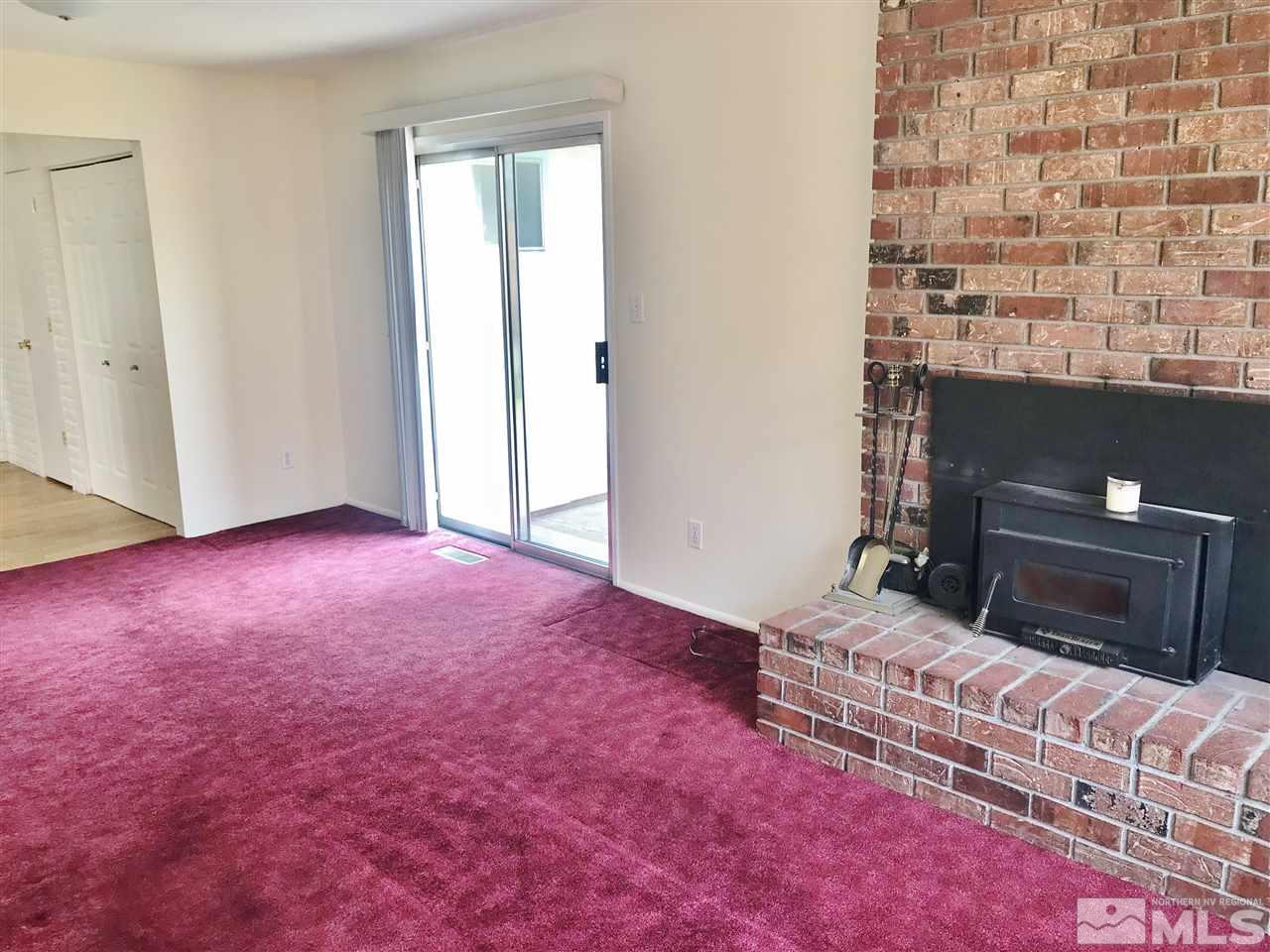 2130 Prince Way Reno, NV 89503 - Photo 9 of 25 a bedroom with a bed and a potted plant