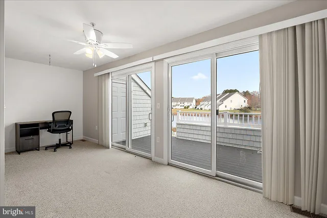 a view of workspace with furniture and windows