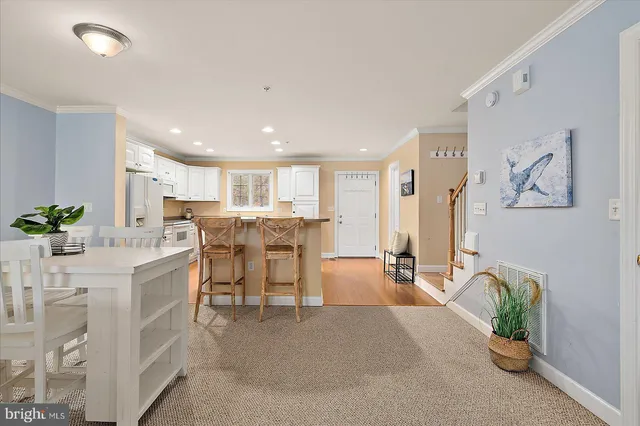 a kitchen with cabinets stainless steel appliances and counter space