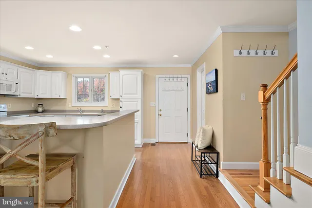 a bathroom with a sink toilet vanity and mirror