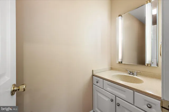 a bathroom with a toilet a sink and a window