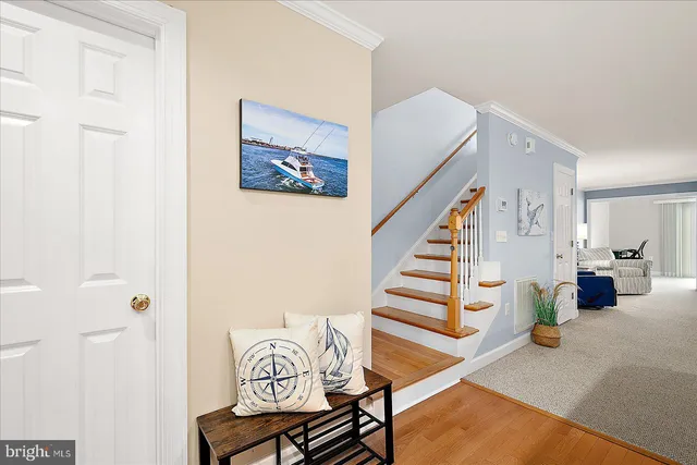 a living room with furniture a fireplace and a ceiling fan