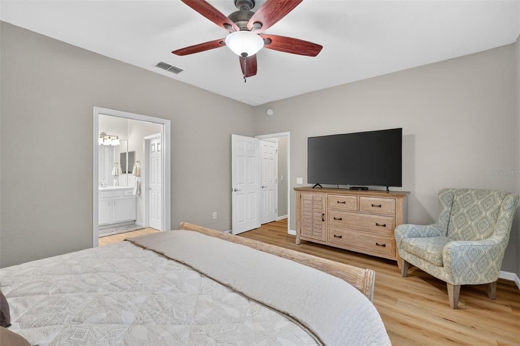 9611 Southwest 71st Loop Ocala, FL 34481 - Photo 17 of 31 a bedroom with furniture and a flat screen tv