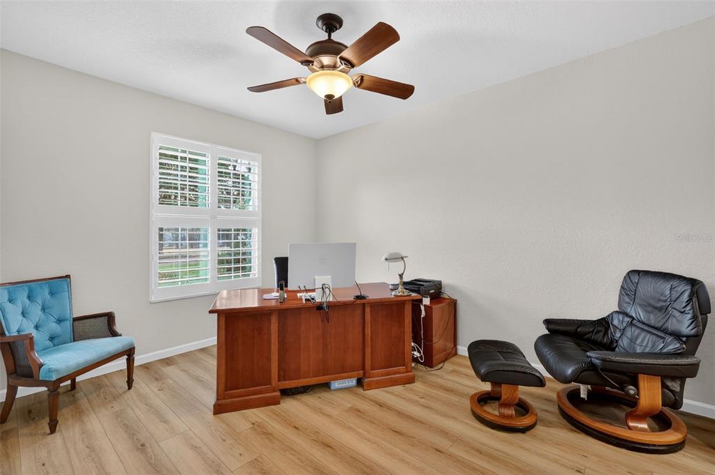 9611 Southwest 71st Loop Ocala, FL 34481 - Photo 22 of 31 a view of a workspace with furniture and a window