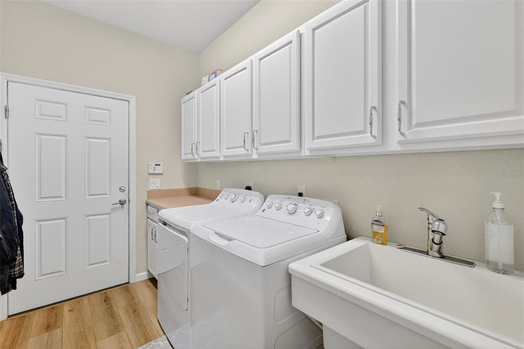 9611 Southwest 71st Loop Ocala, FL 34481 - Photo 24 of 31 a utility room with dryer and washer