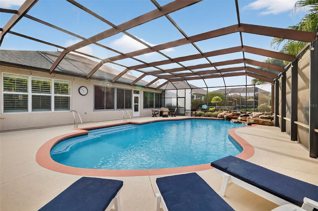 9611 Southwest 71st Loop Ocala, FL 34481 - Photo 27 of 31 a view of a swimming pool with a patio