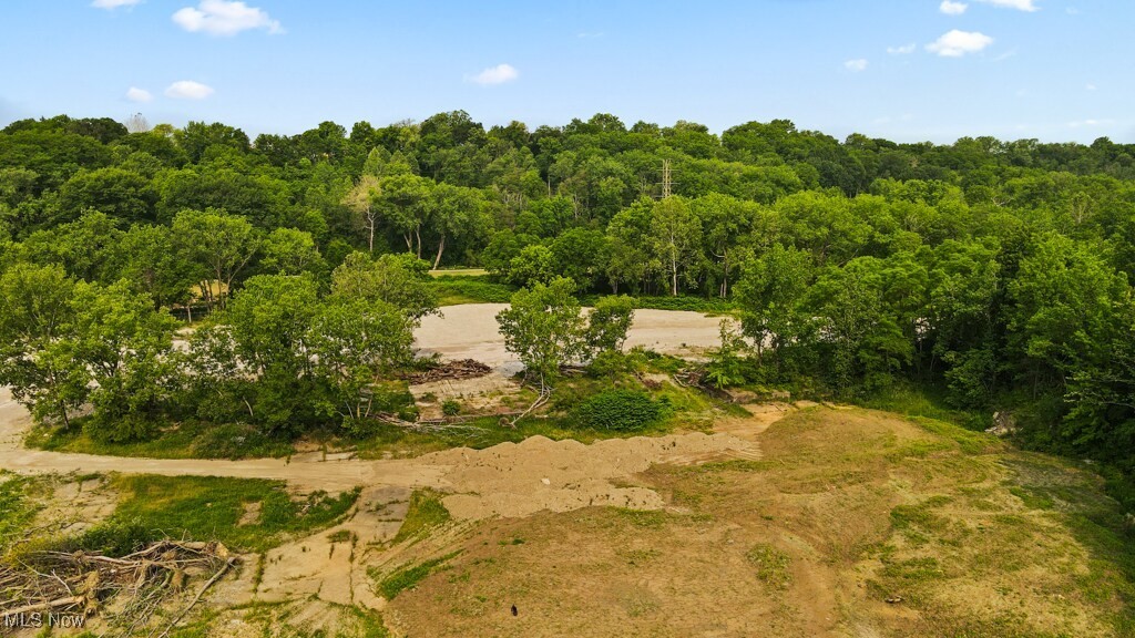 5000 Warner Road Garfield Heights, OH 44125 - Photo 11 of 41 Aerial view of property's location featuring a heavily wooded area