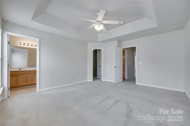 a view of an empty room with a bathroom