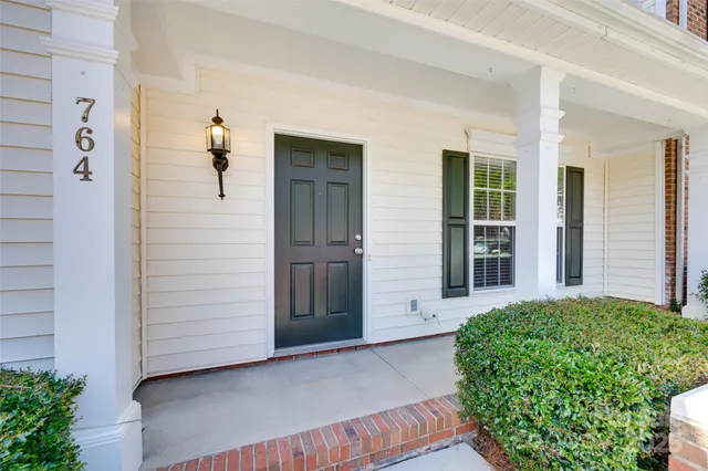 front view of a house with a small yard