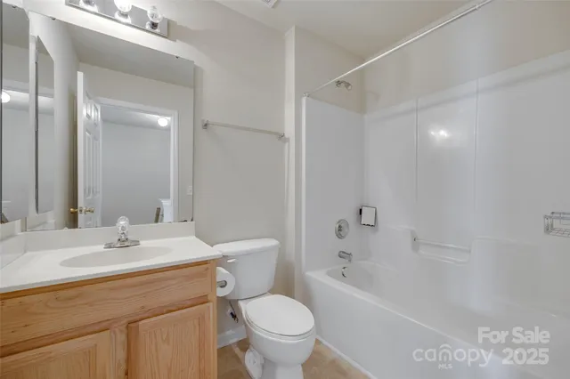 a bathroom with a sink a toilet and a bathtub