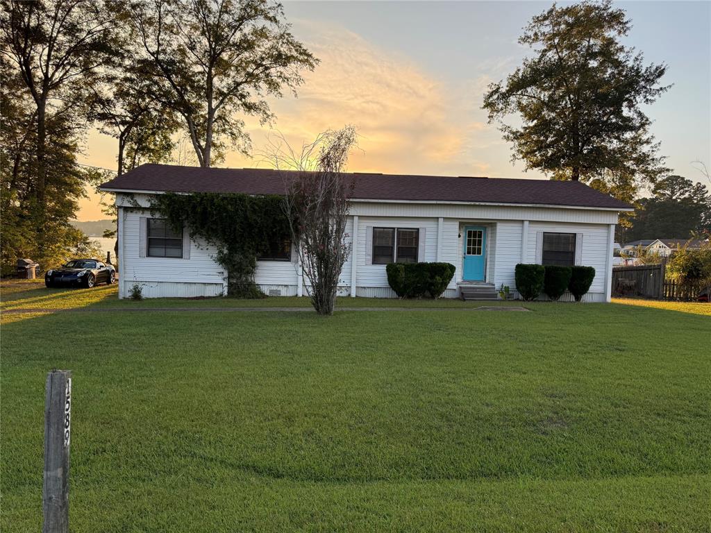 1589 Airport Loop Homer, LA 71040 - Photo 1 of 15 a front view of house with yard and green space
