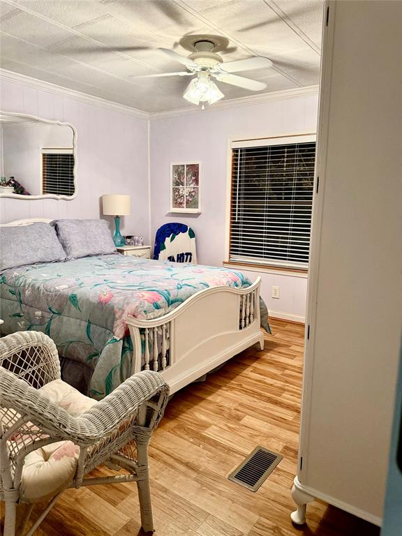 1589 Airport Loop Homer, LA 71040 - Photo 12 of 15 a bedroom with a bed and window