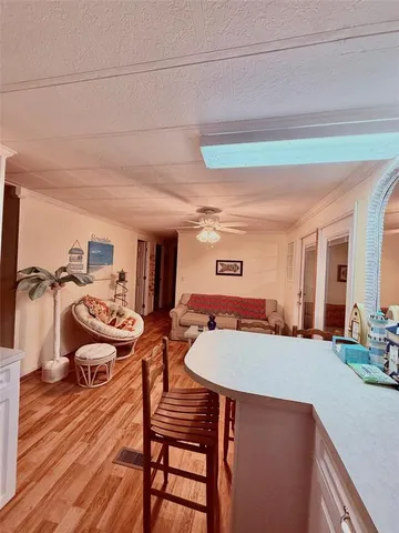 a bedroom with furniture and a wooden floor