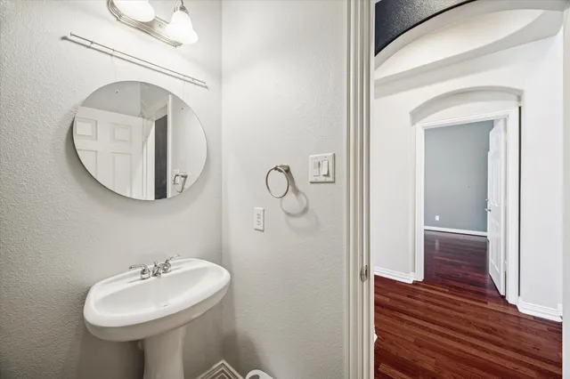 a bathroom with a sink and mirror