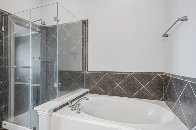 a bathroom with a double vanity sink mirror and shower