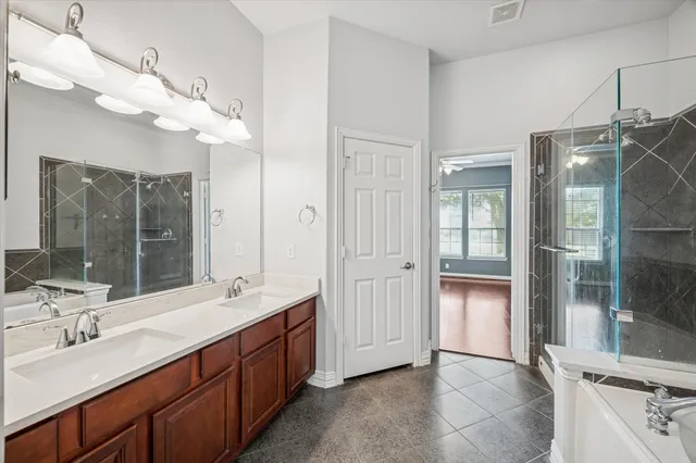 a kitchen with a cabinets and a wooden floor