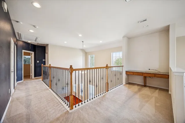 a view of a big room with windows and closet