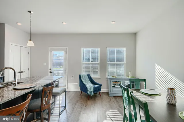 a living room with furniture a window and a chandelier