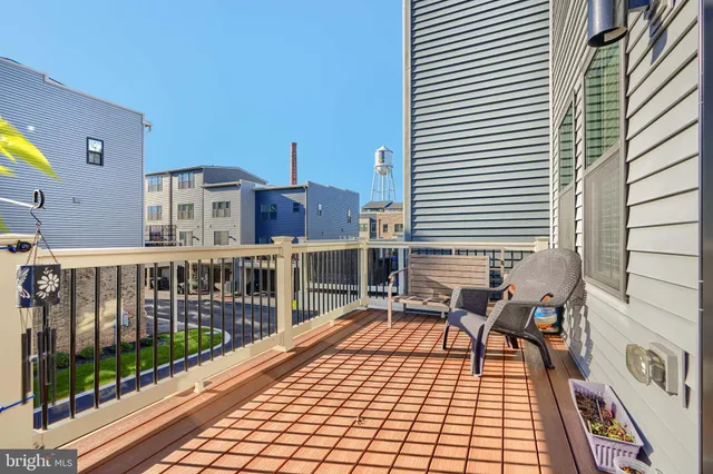 a view of a balcony with wooden floor