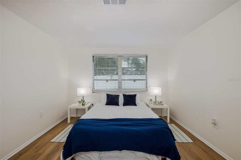 7437 Daggett Terrace New Port Richey, FL 34655 - Photo 18 of 38 a bedroom with a bed and a window