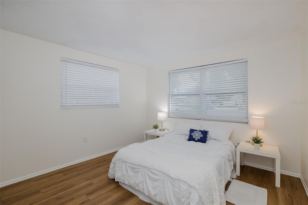 7437 Daggett Terrace New Port Richey, FL 34655 - Photo 26 of 38 a bedroom with a bed and a window