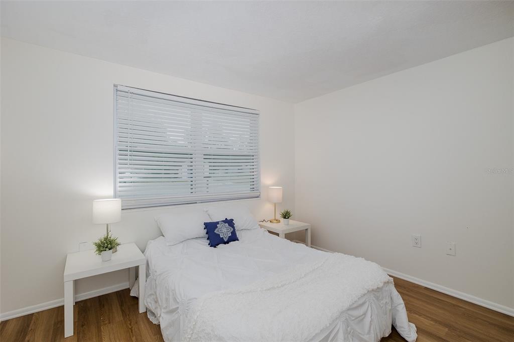 7437 Daggett Terrace New Port Richey, FL 34655 - Photo 27 of 38 a bedroom with a bed and a window