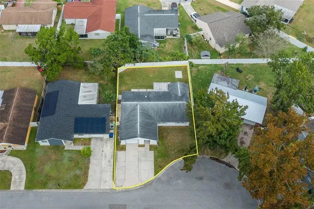 an aerial view of a house with a lake view