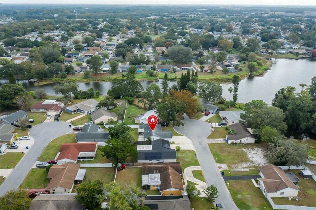 7437 Daggett Terrace New Port Richey, FL 34655 - Photo 31 of 38 an aerial view of residential houses with outdoor space and lake view