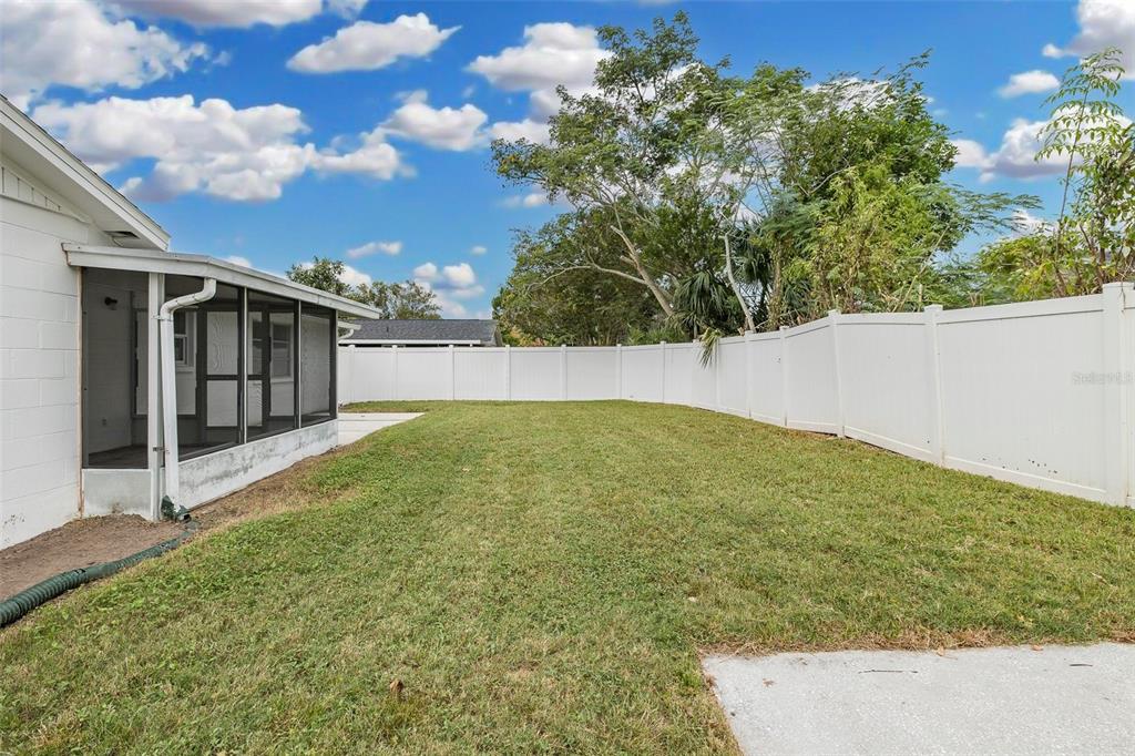 7437 Daggett Terrace New Port Richey, FL 34655 - Photo 36 of 38 a view of an outdoor space and a yard