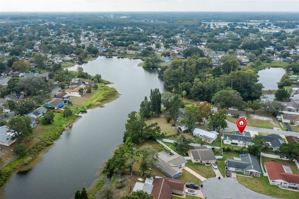 7437 Daggett Terrace New Port Richey, FL 34655 - Photo 4 of 38 an aerial view of a house with a lake view