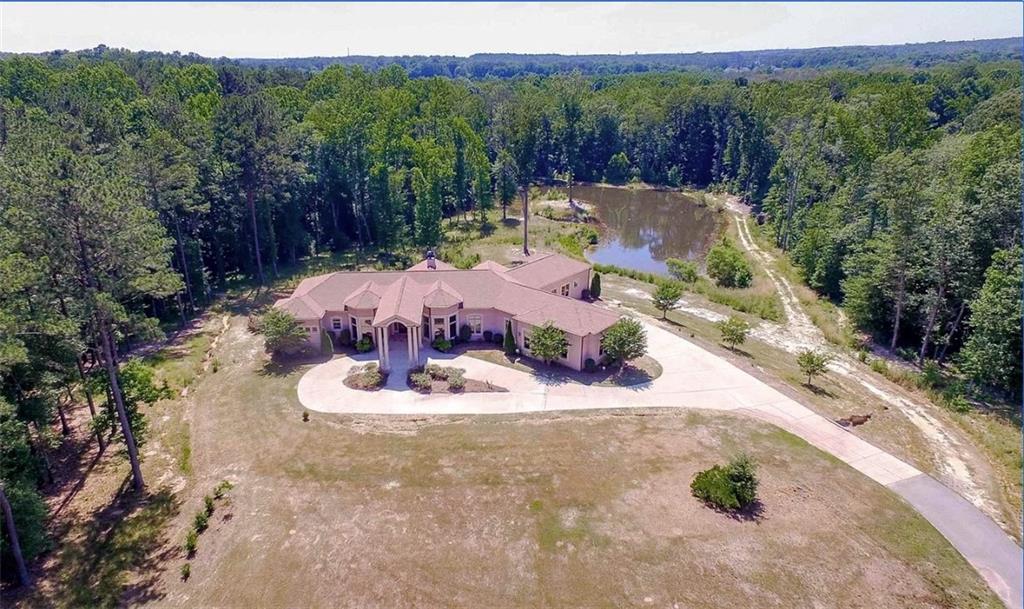 a view of a swimming pool with a yard