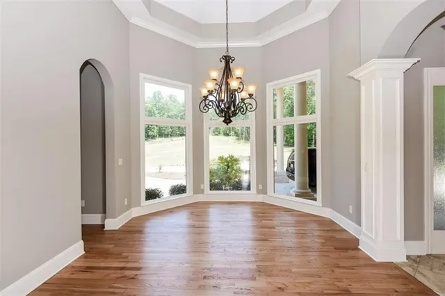 a view of an entryway with wooden floor and windows