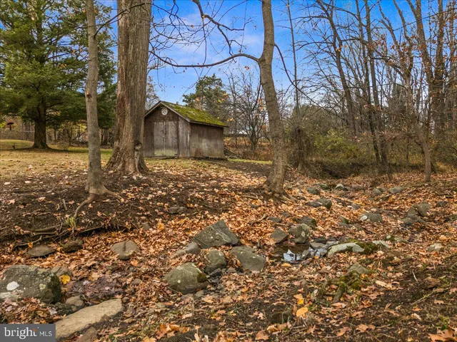 a view of outdoor space with wooden fence