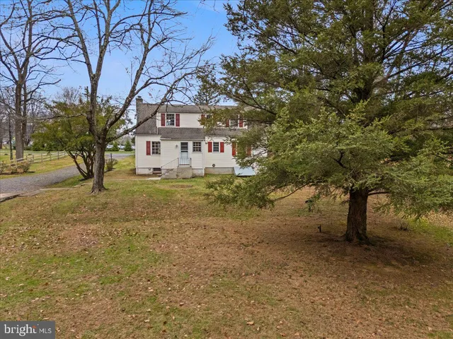 a house with a tree in front of it