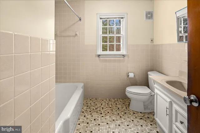 a kitchen with a stove a refrigerator and a sink